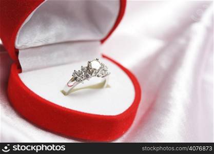 A diamond ring in a jewelry box