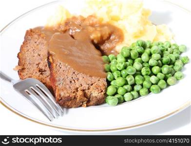 A dinner of meatloaf, peas, mashed potato and gravy - and old favourite.