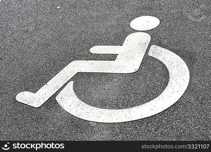 A disability logo in the road