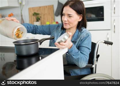 a disable woman cooking past