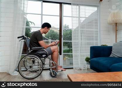 A disabled man sitting in a wheelchair is disappointed and Desperate to heal after car accident. Concept of Careless Driving, Insurance and Mental health care After the accident