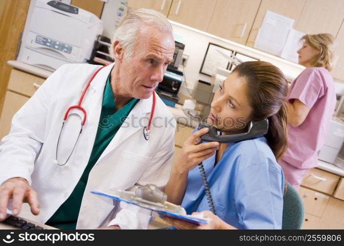 A Doctor And Nurse At The Reception Area Of A Hospital