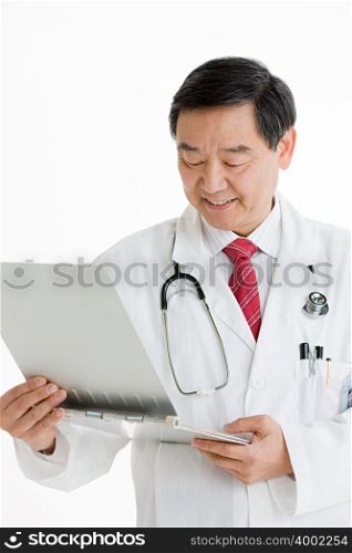 A doctor looking at a chart
