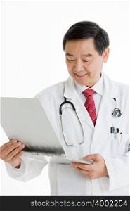 A doctor looking at a chart