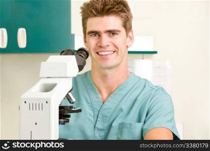 A doctor looking through a microscope