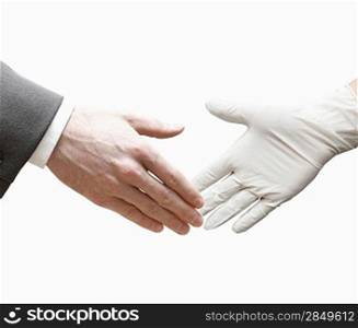A doctor shaking hands with a business man