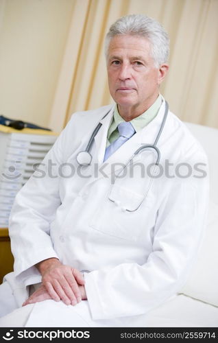 A Doctor Sitting On A Hospital Bed