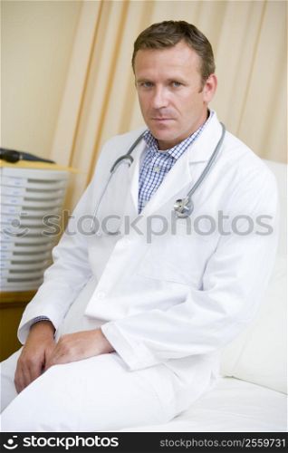 A Doctor Sitting On A Hospital Bed