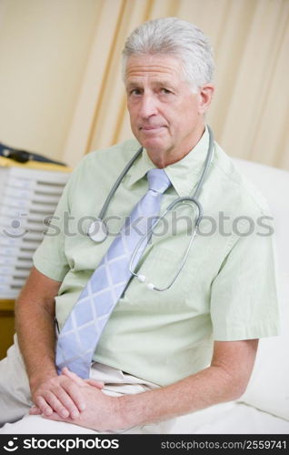 A Doctor Sitting On A Hospital Bed