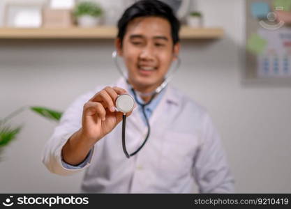 a doctor using a stethoscope to check a patient&rsquo;s heart. Selective focus