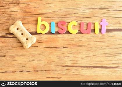 A dog biscuit with the word biscuit