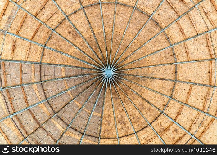 A dome made with Oriented Strand Board wood, also called OSB, with a metallic structure seen from below