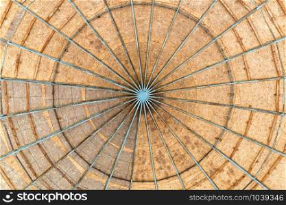 A dome made with Oriented Strand Board wood, also called OSB, with a metallic structure seen from below