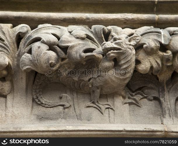 A dragon is carved into a decorative frieze over the door of the St. Giles Cathedral in Edinburgh, Scotland. A fine example of draftsmanship from medieval stoneworkers.
