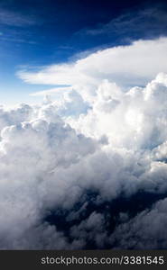 A dramatic cloudscape background with cumulus clouds