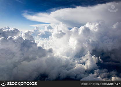 A dramatic cloudscape background with cumulus clouds