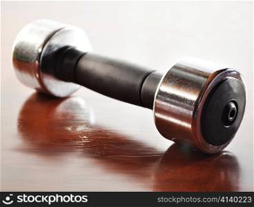 a dumbbell , close up shot with reflection