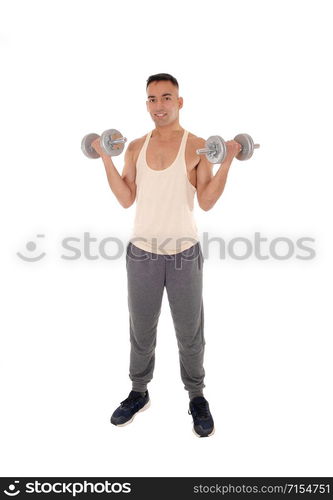 A east Indian man working out with two dumbbells in his track pants, isolated for white background