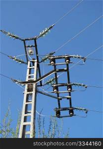 a electricity pylon with double hook on you blue sky
