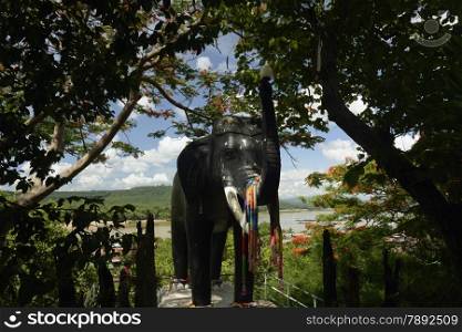 a elephant at the temple Wat Tham Khu Ha Sawan in Khong Jiam on the Mekong River near Khong Chiam in the provinz of Ubon Rachathani in the Region of Isan in Northeast Thailand in Thailand.&#xA;