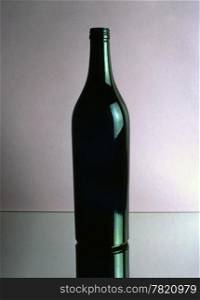 A empty wine bottle isolated on mirror