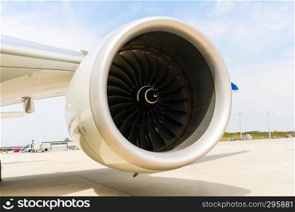 A Engine of modern passenger jet airplane. Rotating fan and turbine blades.