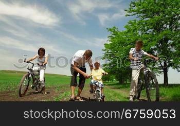 A family bike ride down a country lane