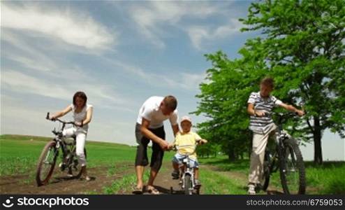 A family bike ride down a country lane