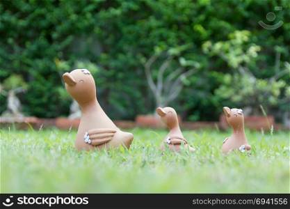A family of clay doll duck (Mom & Baby) in the garden