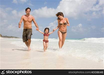 A family running through the sea