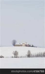 A farm with snow and winter landscape