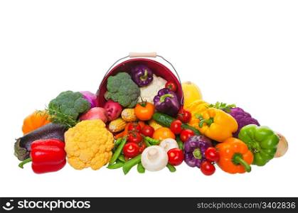 A farmer?s market display of fresh vegetables with a red bushel basket. Shot on white background.