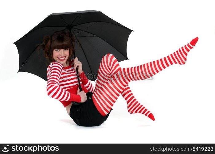 A fashion brunette with an umbrella.