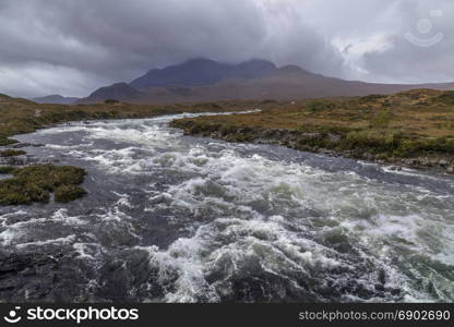 A fast flowing river in the Cuillin Hills on the Isle of Skye in the Inner Hebrides of northwest Scotland.