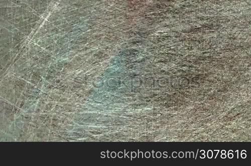 a fast moving computer generated multicolored background, with a rough fabric texture and broken geometrical shapes