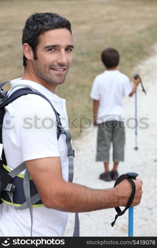 a father and his son hiking