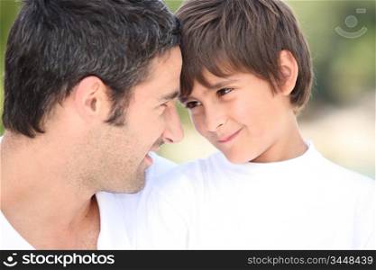 a father and his son looking each other in the eyes