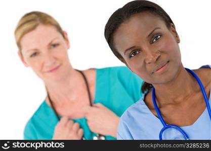 A female African American doctor with her colleague out of focus behind her