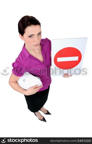 A female architect holding a stop sign.