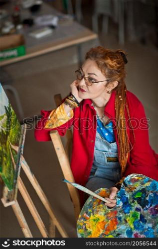 A female artist in a creative setting.. Portrait of a creative person in a working environment 2930.