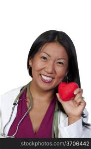 A female cardiologist holding a red heart