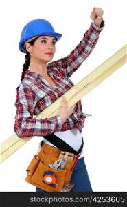 A female carpenter pointing at something.