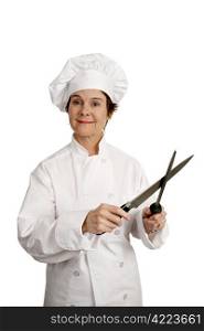 A female chef sharpening her knife. Three quarter view isolated on white.