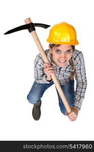 A female construction an pickaxe.