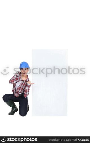 A female construction worker promoting.
