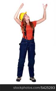 A female construction worker repositioning something.