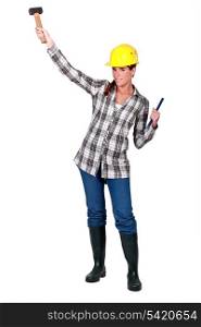A female construction worker with a hammer.