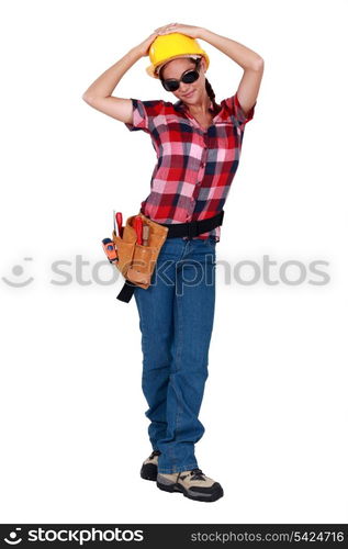 A female construction worker with sunglasses on.