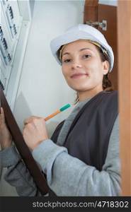 a female electrical reader with clipboard