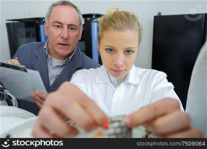 a female electronic apprentice with cables
